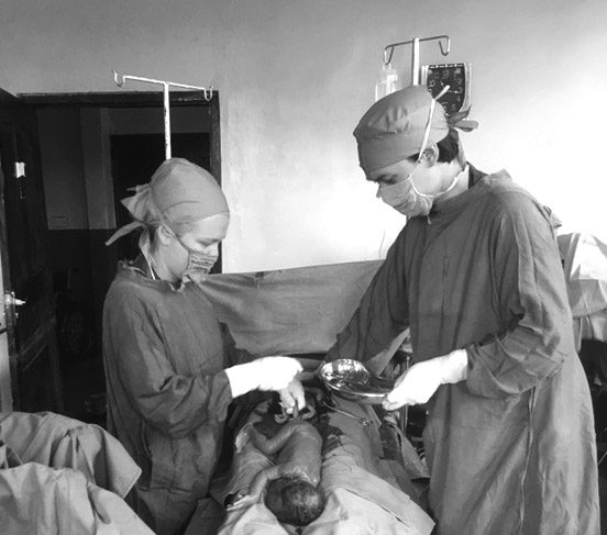 Drs Branden & Shannon delivering a baby in Madagascar